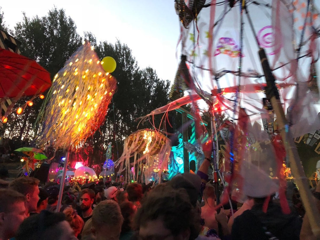 festival dancefloor with totems and crowd dancing