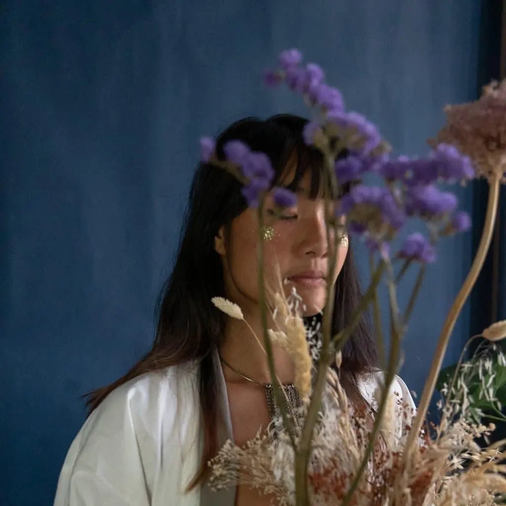 female with glitter cheeks with flowers