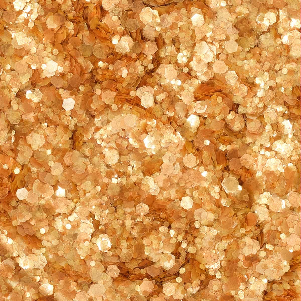 Close-up of a textured glitter with a warm, brownish-orange color.