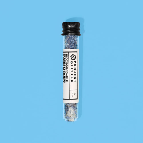 Test tube with blue glitter on a blue background