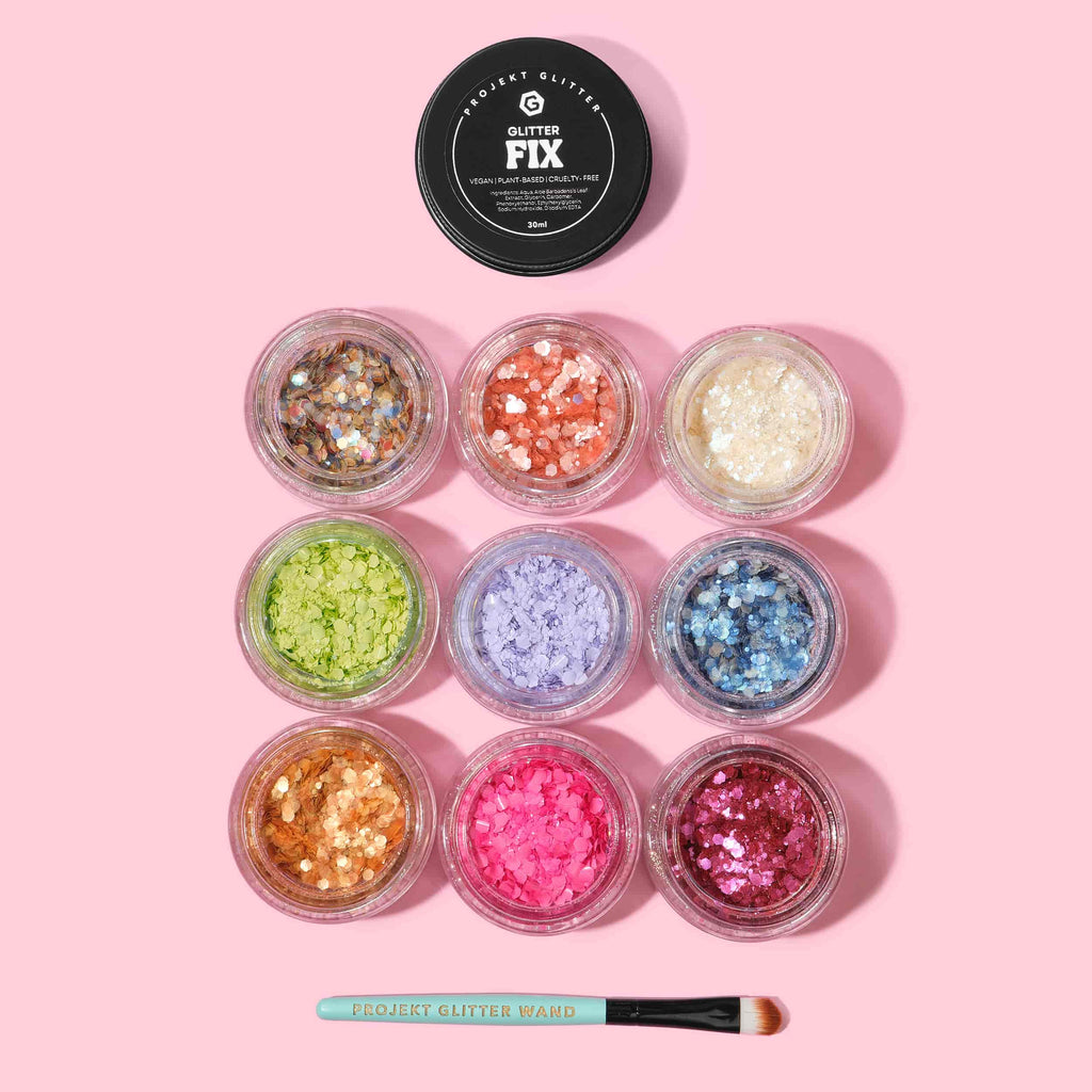 Assorted glitter jars with a 'Glitter Fix' product on a pink background